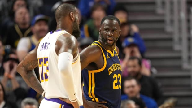 Golden State Warriors' Draymond Green and Los Angeles Lakers' LeBron James